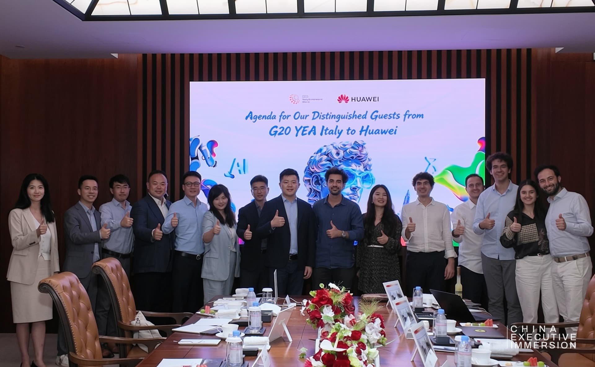 Huawei — the delegation received at the campus, agenda on screen — Shenzhen