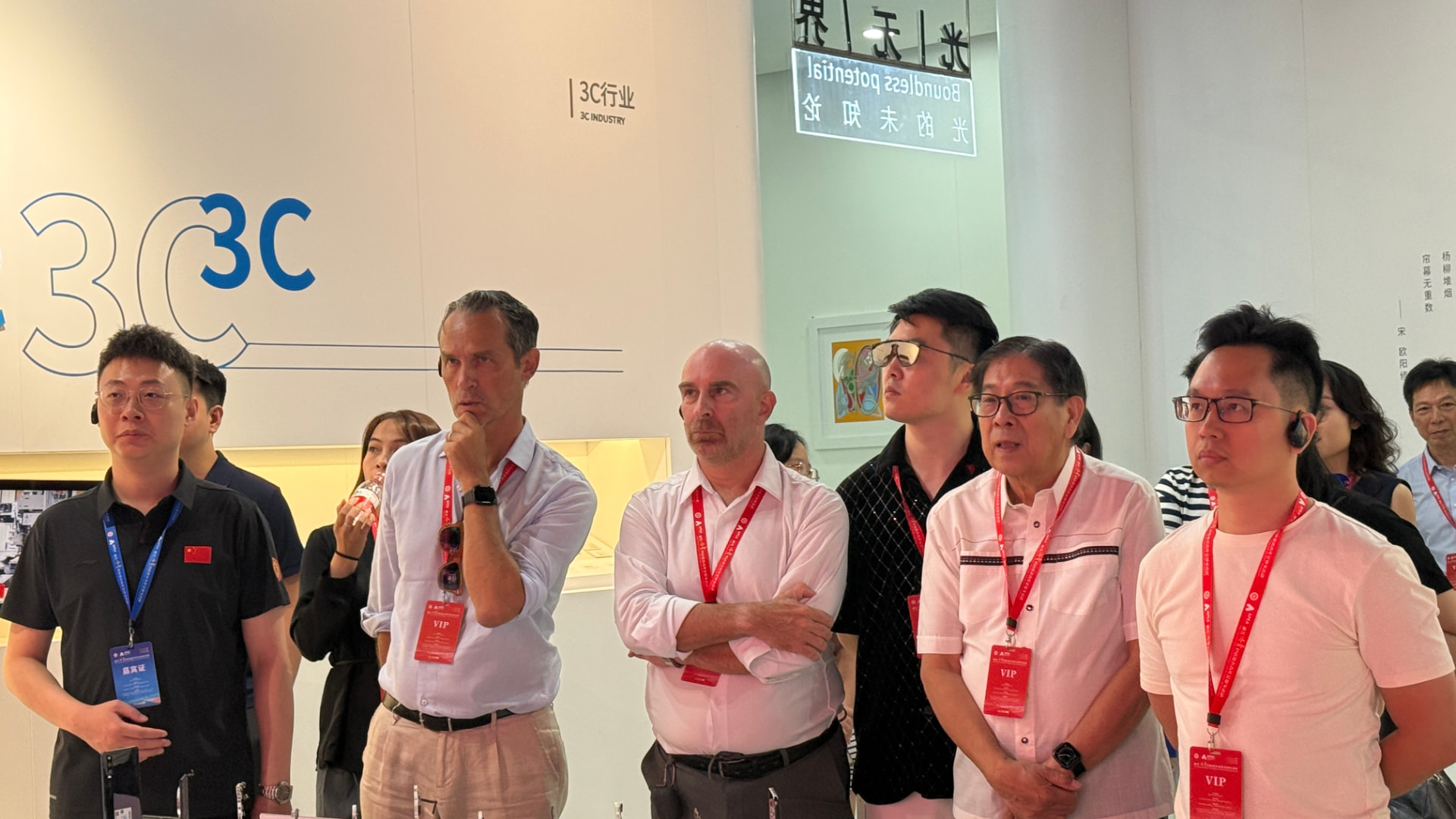 Advanced manufacturing showroom — European and Asian delegates in the 3C precision-manufacturing hall — Guangdong
